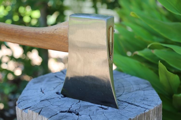 An axe embedded in a chopping block