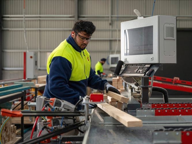 inside a building with machinery for a frame and truss plant