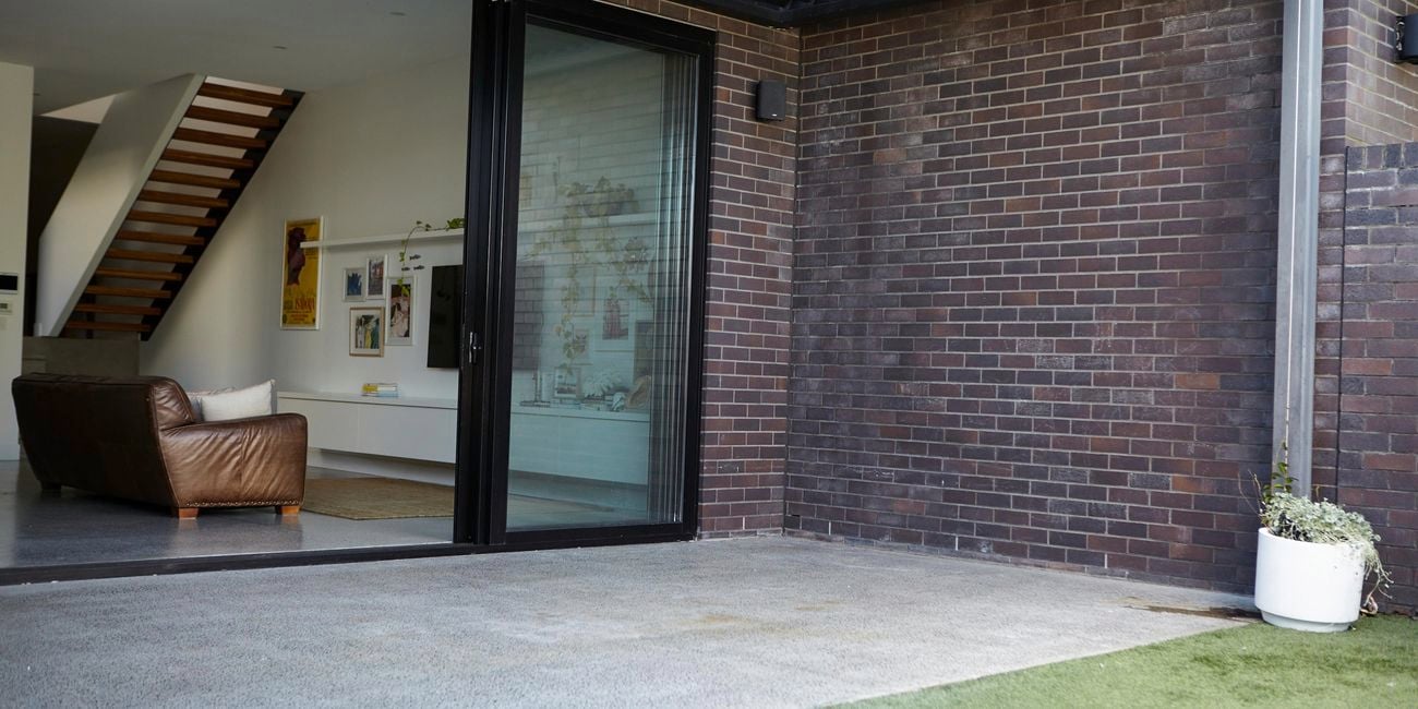 Empty courtyard with concrete floor and brick wall