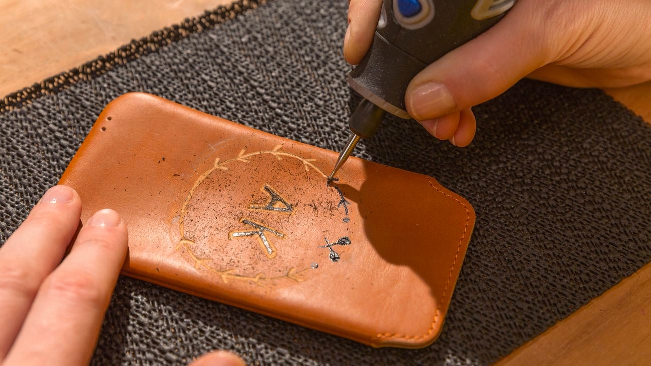 Dremel rotary tool engraving a leather patch
