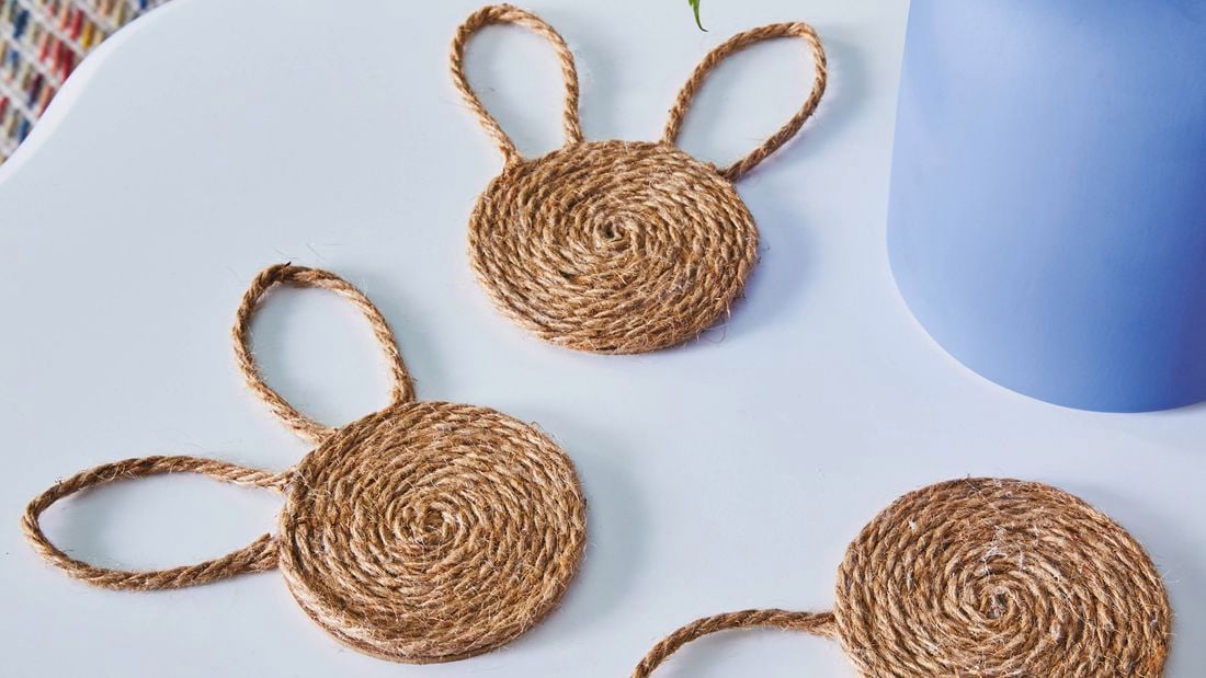 bunny shaped jute coasters on a  coffee table