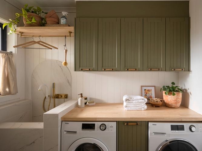 Laundry cabinetry with a pet bathing area