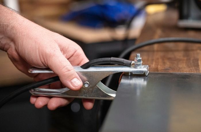 Attach the earth clamp to your mig welder