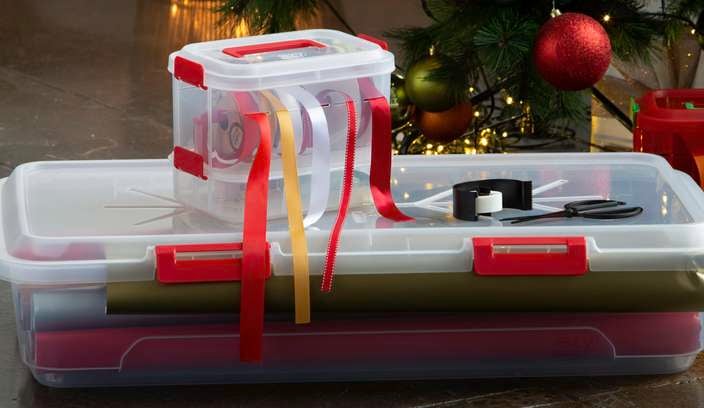 2 x Storage containers with ribbon and wrapping paper in them