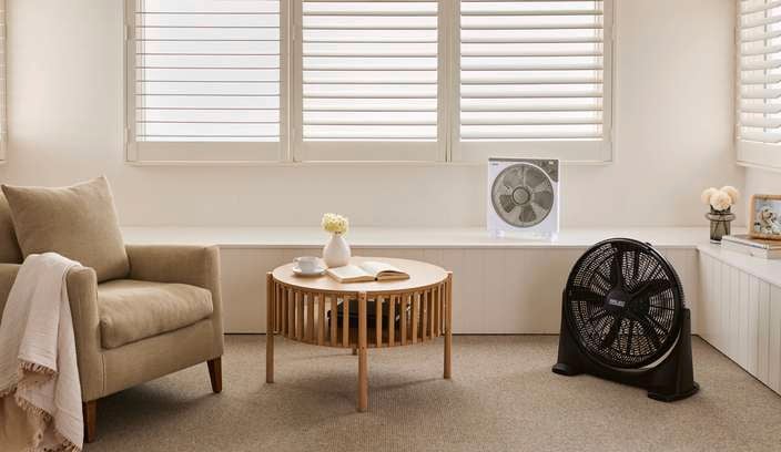 Living room with different types of fans on display