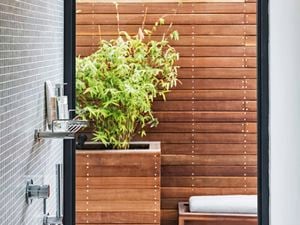 A modern small bathroom with a large window.
