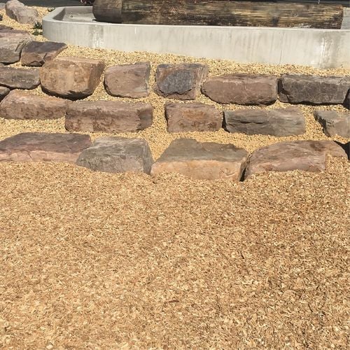 Stone wall with wood chips