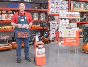 Rug Doctors carpet cleaner with a Bunnings team member standing beside the machine