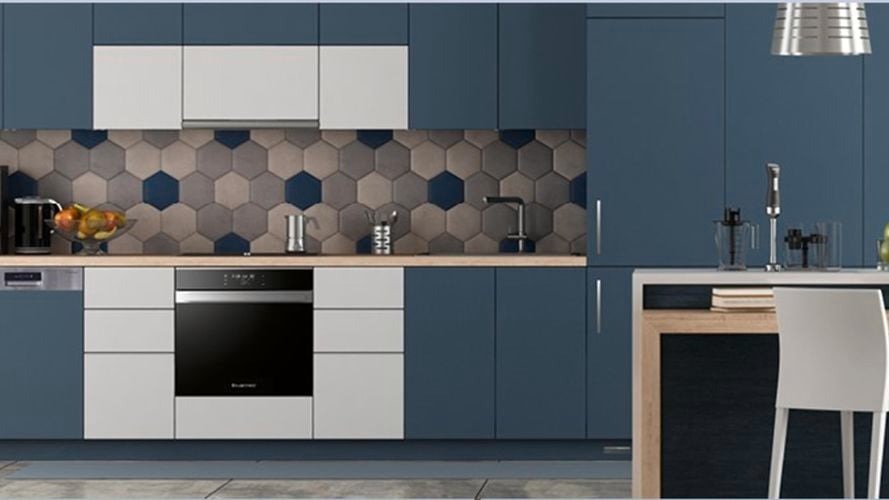 Blue kitchen with mosaic tile splashback and Slide Out Rangehgood, Stainless Steel Semi Integrated Dishwasher and  Fully Integrated Fridge Freezer