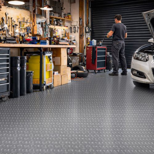 Checker-plate garage flooring, easy to DIY install with durable PVC surface.