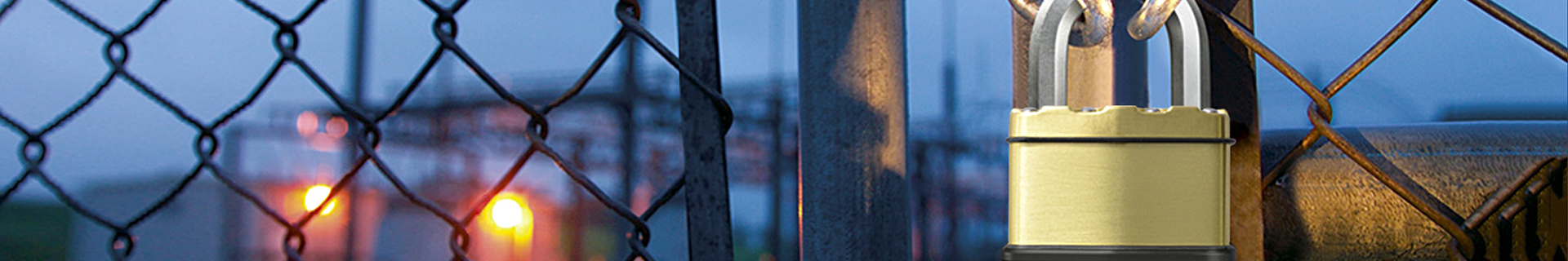 Close-up of Master Lock padlock chaining a gate closed