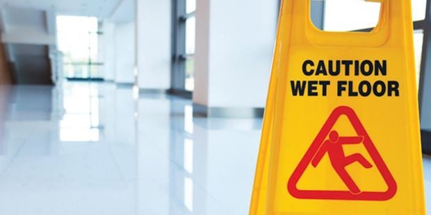 Caution wet floor sign in hallway