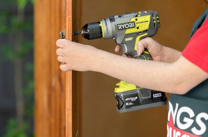 Unscrewing wardrobe handle with power drill