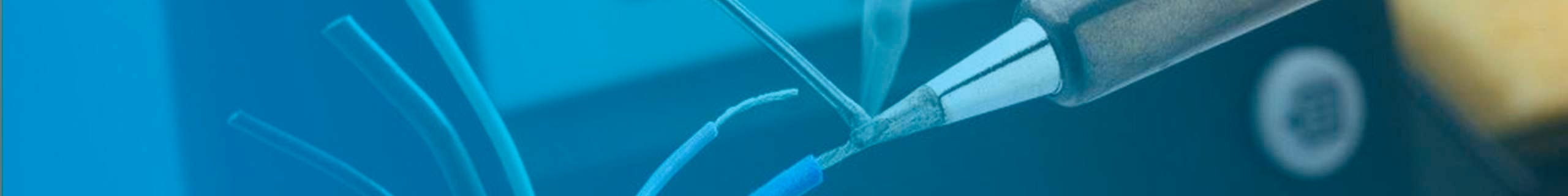 A soldering iron coming into contact with solder and an electrical wire