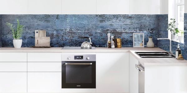 Scandi-style minimal kitchen featuring a blue splashback