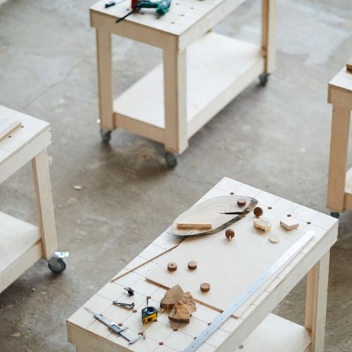 Timber workbenches on wheels.