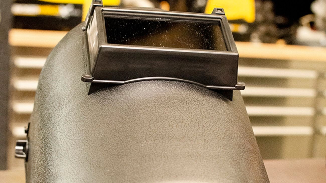 Close up shot of a grey welding helmet.