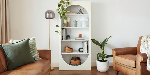 Bookcase styled with home decor objects.