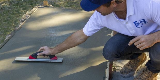 Person paving cement