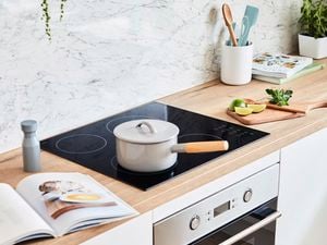 Kitchen with pot on stovetop.
