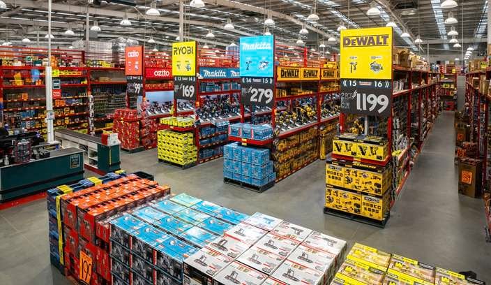 Interior of the Bunnings Carrum Downs Tool Shop with wide aisles of power tools, branded displays, and stacked tool kits under warehouse lighting.