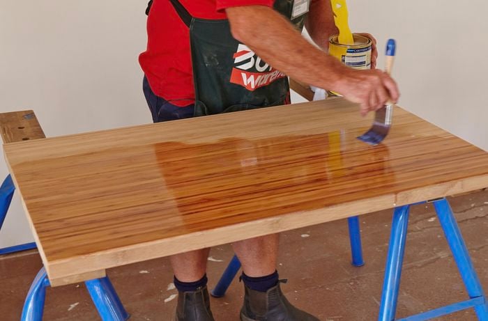 A benchtop being varnished