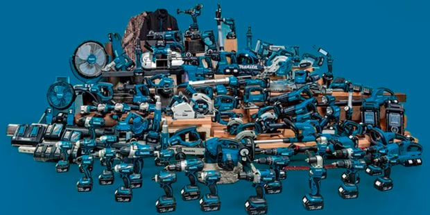 Lots of power tools in a pile.