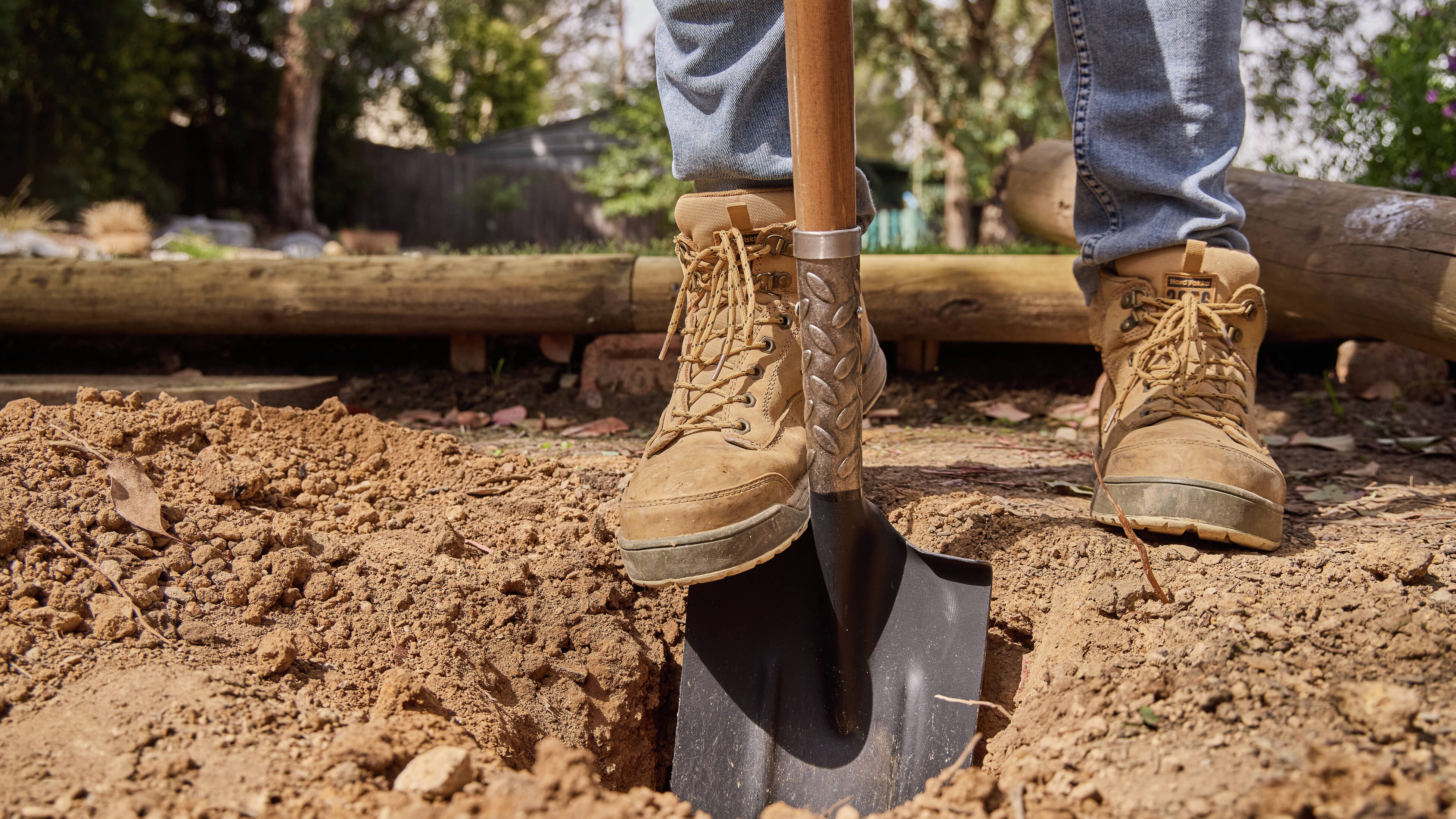 A person digging with a shovel.