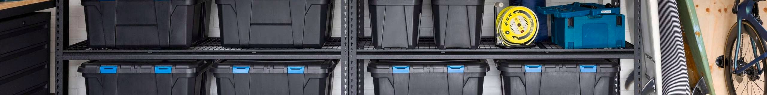 Inabox header with black plastic tubs on storage racking