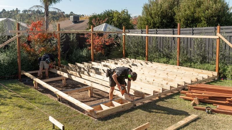man installing joist to the bearers