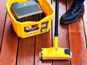 Staining a deck with a Cabots bucket and applicator