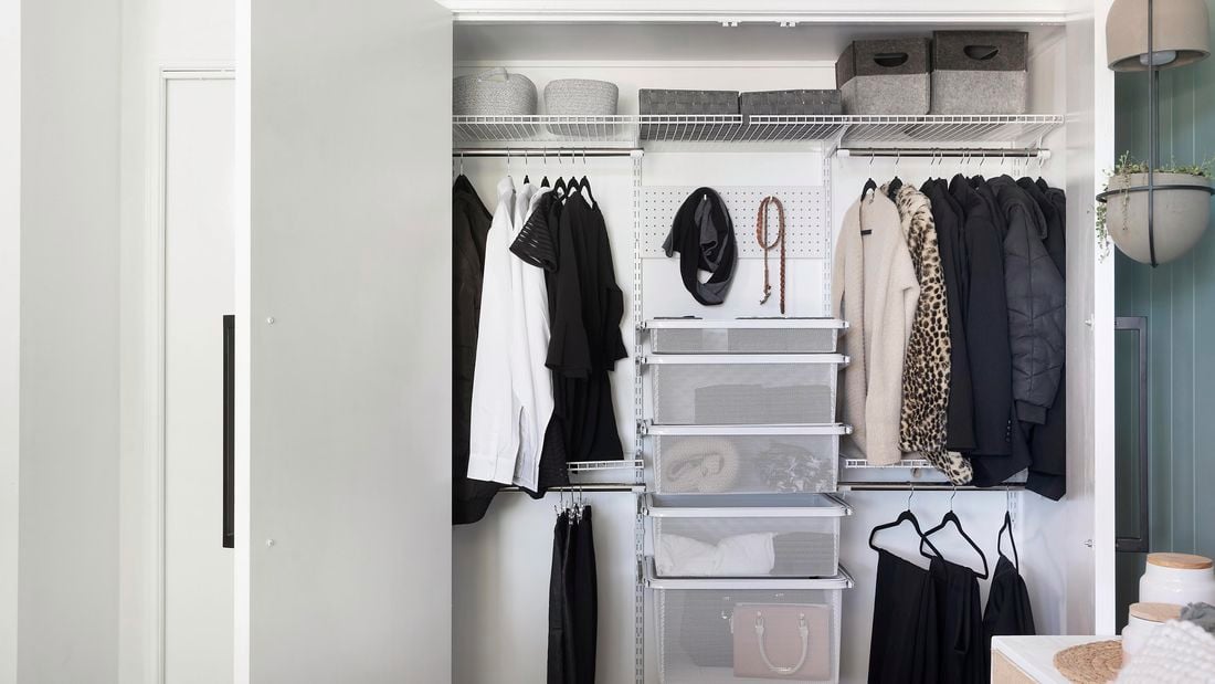 A tidy wardrobe with hanging space, wire drawers and shelving