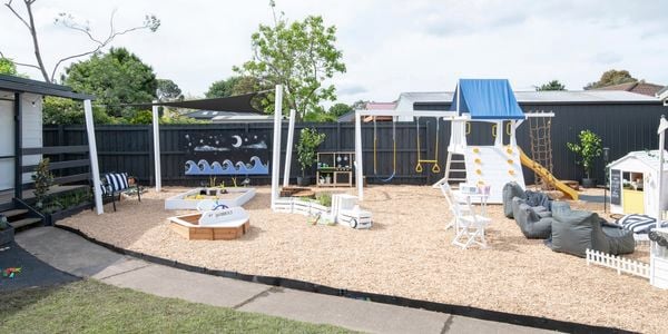 Completed kids backyard with outdoor cubbies, three piece outdoor setting, outdoor bean bags, swing set, play equipment and sandpits.