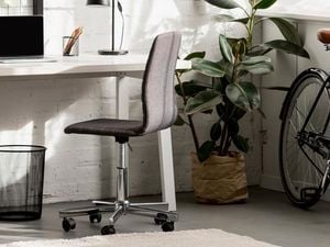 Office space with a laptop on the desk.