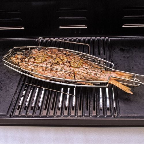 Roasted fish sitting on a barbecue