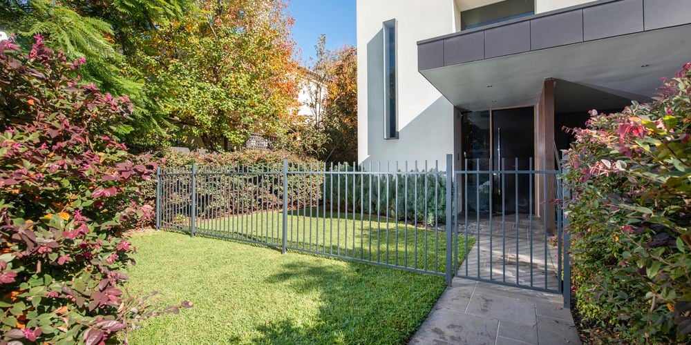 Squaretube fencing at front of a house.