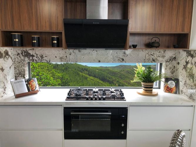 Timber and white kitchen with mountain view and Vertical Black Glass Wall Mounted Rangehood, Gas on Black Krystal Glass Cooktop  and Multifunction Oven
