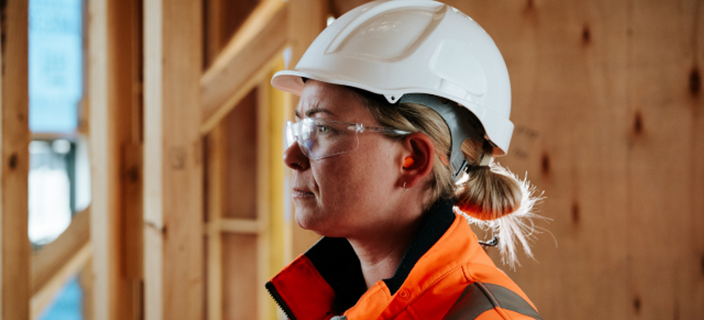Citeco header of female tradie wearing branded PPE in a construction zone