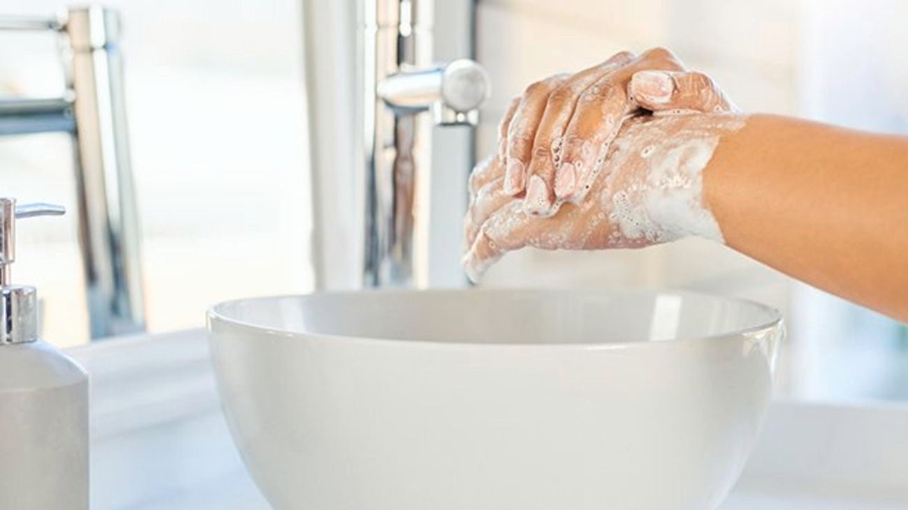 A person washing their hands