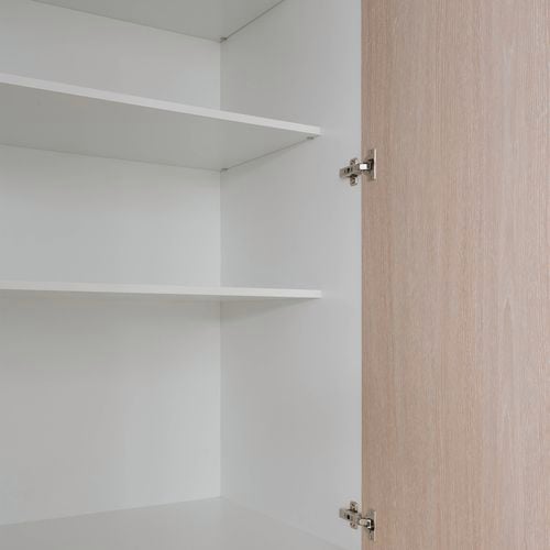 CUSTOMpine cabinetry with levels of storage and a focus on the hinges