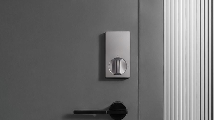 Aqara smart door lock installed on a grey door
