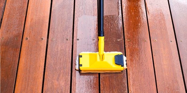Using a deck applicator to oil a deck