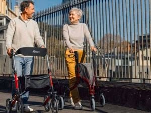 Two people using mobility aids.
