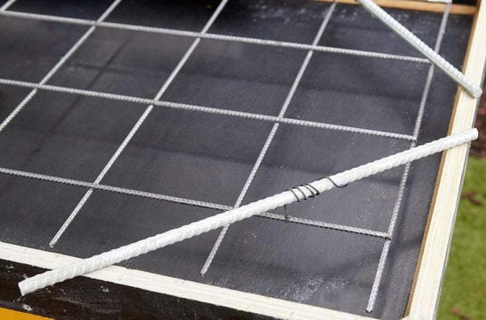 Reinforcing mesh sitting on top of form ply frame.