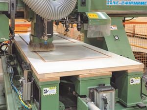 Machinery in a factory manufacturing a new door