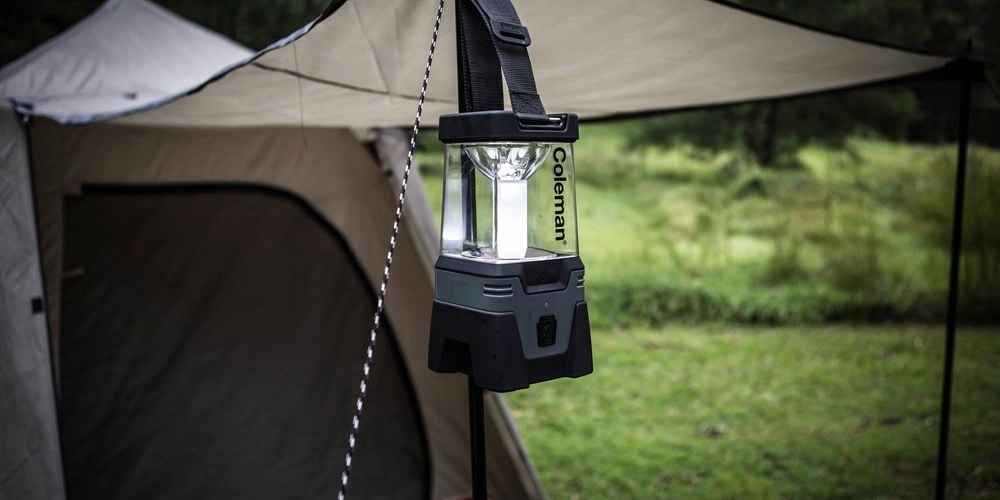 Coleman Easy Hang Lantern hanging at a campsite