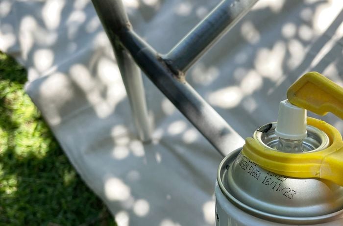 Applying rust converter to create a solid base for painting is an essential step in your D.I.Y. outdoor chair weaving project. 