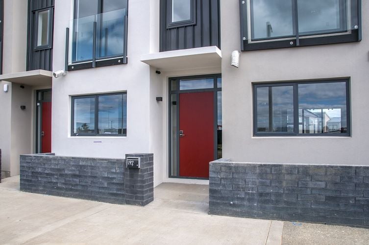 Front entryway to unit with red door