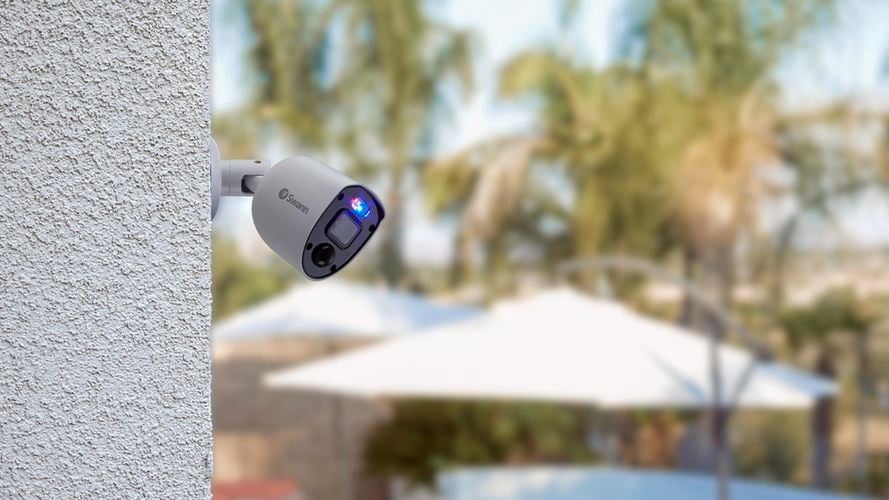 Security camera on a rendered wall outside