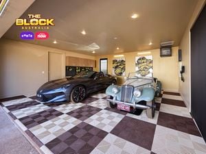 Garage from The Block with patterned flooring, storage cabinetry, and two luxury cars.